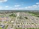 This aerial view highlights the neighborhood's layout, green spaces, and residential architecture at 10233 Opaline Sky Pl, Riverview, FL 33578