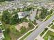 An aerial shot showcasing the community amenities, including the pool, clubhouse, and basketball court at 10233 Opaline Sky Pl, Riverview, FL 33578