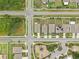 An aerial view shows houses with solar panels, a playground, and a basketball court at 10233 Opaline Sky Pl, Riverview, FL 33578