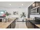 Bright kitchen featuring stainless appliances, granite countertops, and recessed lighting at 10233 Opaline Sky Pl, Riverview, FL 33578