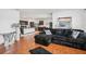 Open floor plan showcasing the living room, kitchen with island and modern decor at 10233 Opaline Sky Pl, Riverview, FL 33578