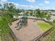 Aerial view of playground, with slides, swings, and climbing structures set within a landscaped park at 10233 Opaline Sky Pl, Riverview, FL 33578
