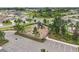 Aerial view shows playground featuring modern equipment, safety surfacing, and surrounding green space at 10233 Opaline Sky Pl, Riverview, FL 33578