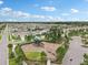 Aerial view of a well-maintained community playground with modern play equipment and landscaped surroundings at 10233 Opaline Sky Pl, Riverview, FL 33578