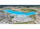 Aerial view of the community lagoon, amenities, beach and recreational facilities at 10381 Tupper Cay Dr, San Antonio, FL 33576