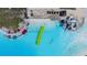 Lagoon featuring kayaks and a water slide, surrounded by a beautiful sandy beach at 10381 Tupper Cay Dr, San Antonio, FL 33576