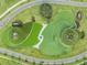 Bird's eye view of the community's unique circular water features and landscaping at 10381 Tupper Cay Dr, San Antonio, FL 33576
