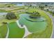 Aerial perspective of the community water feature and natural surroundings at 10381 Tupper Cay Dr, San Antonio, FL 33576