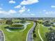 Aerial view of the community featuring beautifully landscaped grounds and water features at 10381 Tupper Cay Dr, San Antonio, FL 33576