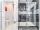 Modern bathroom featuring a stylish glass-enclosed shower with sleek, gray-toned tiling and luxurious fixtures at 10381 Tupper Cay Dr, San Antonio, FL 33576