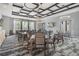 Inviting dining room featuring modern lighting, comfortable seating, and contemporary decor at 10381 Tupper Cay Dr, San Antonio, FL 33576