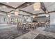 Elegant event space featuring decorative lighting, tables, chairs, and large windows at 10381 Tupper Cay Dr, San Antonio, FL 33576