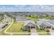 Beautifully landscaped single-Gathering home with a two-car garage and manicured front lawn in a community at 10381 Tupper Cay Dr, San Antonio, FL 33576