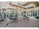 Spacious gym with a variety of weight machines and equipment for a comprehensive workout at 10381 Tupper Cay Dr, San Antonio, FL 33576