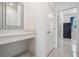 Bright hallway with a vanity and tiled floors at 10381 Tupper Cay Dr, San Antonio, FL 33576