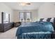 Spacious main bedroom with a large bed, dresser, and large windows providing great natural light at 10381 Tupper Cay Dr, San Antonio, FL 33576