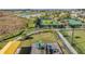 Aerial view of playground and tennis courts with picturesque walking paths at 10381 Tupper Cay Dr, San Antonio, FL 33576