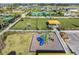 Aerial view of a playground with green space and covered seating at 10381 Tupper Cay Dr, San Antonio, FL 33576