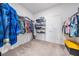 Spacious walk-in closet with ample shelving and hanging space for organized storage and convenience at 10381 Tupper Cay Dr, San Antonio, FL 33576