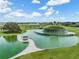 Stunning water feature with gazebo offers a serene setting within the community at 10381 Tupper Cay Dr, San Antonio, FL 33576