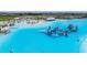 Inflatable waterpark situated on the lagoon, with a view of the sandy beach, and water activities at 10381 Tupper Cay Dr, San Antonio, FL 33576