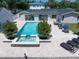 Aerial view of the backyard pool with spa and patio with outdoor furniture at 10875 131St St, Largo, FL 33774