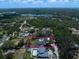 Stunning aerial view of the home featuring a pool and lush landscaping in a beautiful neighborhood at 10875 131St St, Largo, FL 33774