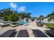 Backyard pool, lounge chairs, outdoor furniture, and patio at 10875 131St St, Largo, FL 33774