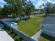 Fenced-in backyard featuring a spacious lawn and a storage shed, perfect for outdoor activities at 10875 131St St, Largo, FL 33774