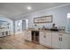 Stylish bar area featuring a built-in wine fridge and countertop space at 10875 131St St, Largo, FL 33774