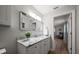 Bathroom vanity featuring granite countertops and soft, natural light at 10875 131St St, Largo, FL 33774