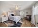 Cozy bedroom with a ceiling fan, blue accents, and ample natural light at 10875 131St St, Largo, FL 33774