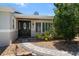 Charming front entrance with a decorative door, manicured landscaping, and a welcoming walkway at 10875 131St St, Largo, FL 33774