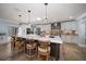 Bright, open kitchen featuring a large island, modern appliances, and stylish pendant lighting at 10875 131St St, Largo, FL 33774