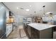 Spacious kitchen with a large island, stainless steel appliances, and seamless flow into the dining area at 10875 131St St, Largo, FL 33774