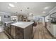 Open-concept kitchen with a large island, fireplace, and dining area, perfect for entertaining at 10875 131St St, Largo, FL 33774