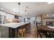 Kitchen view featuring a large island with bar seating, modern appliances, and direct access to the dining area at 10875 131St St, Largo, FL 33774