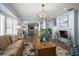 Cozy living room showcasing a fireplace, hardwood floors, and a comfortable seating area at 10875 131St St, Largo, FL 33774