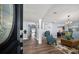 Bright living room featuring hardwood floors, an open floor plan, and stylish décor at 10875 131St St, Largo, FL 33774