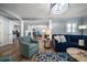 Spacious living room with an open floorplan, hardwood floors, and modern decor with natural light at 10875 131St St, Largo, FL 33774
