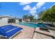 Beautiful pool area with tanning chairs, tiled deck and landscaping at 10875 131St St, Largo, FL 33774