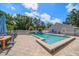 Backyard pool with spa, outdoor furniture, and ample patio space at 10875 131St St, Largo, FL 33774
