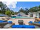 Backyard pool with spa, patio, and outdoor seating arrangement at 10875 131St St, Largo, FL 33774