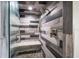 Modern shower featuring stylish gray and white horizontal tile and a built-in bench at 10875 131St St, Largo, FL 33774