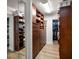 Spacious walk-in closet featuring custom wood shelving and ample storage at 10875 131St St, Largo, FL 33774