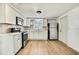 The renovated kitchen boasts modern stainless appliances and new cabinets at 11130 White Oak Ln, Port Richey, FL 34668