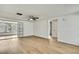 The living room has an open floor plan and modern ceiling fan at 11130 White Oak Ln, Port Richey, FL 34668