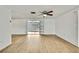 The living room has an open floor plan and modern ceiling fan at 11130 White Oak Ln, Port Richey, FL 34668