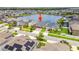 Aerial view of the property showcasing its location on a tranquil lake within a well-maintained neighborhood at 11522 Sunburst Marble Rd, Riverview, FL 33579