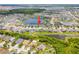 Wide aerial view showcasing the property's location within a scenic community surrounded by lakes at 11522 Sunburst Marble Rd, Riverview, FL 33579